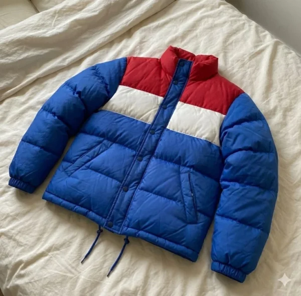 A red, white, and blue puffer jacket inspired by Stranger Things, featuring premium insulation and standout retro style.